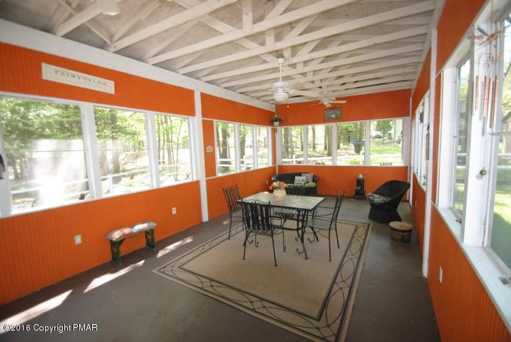 90 Highridge Road Albrightsville, PA 18210 - Photo 21 of 30 a dining room with furniture and a floor to ceiling window