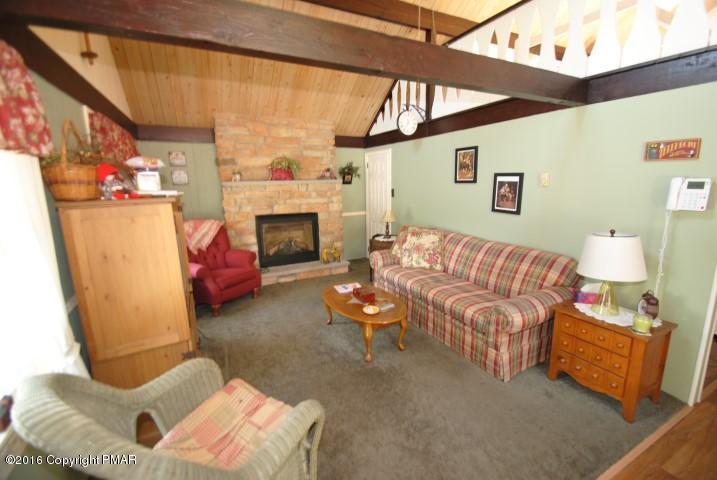 90 Highridge Road Albrightsville, PA 18210 - Photo 3 of 30 a living room with furniture and a fireplace