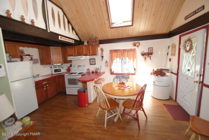 90 Highridge Road Albrightsville, PA 18210 - Photo 5 of 30 a kitchen with a sink and wooden cabinets