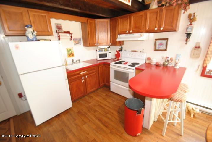 90 Highridge Road Albrightsville, PA 18210 - Photo 6 of 30 a kitchen with stainless steel appliances granite countertop a refrigerator a sink a stove and a refrigerator