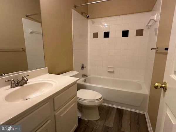 a bathroom with a sink a toilet and a bathtub