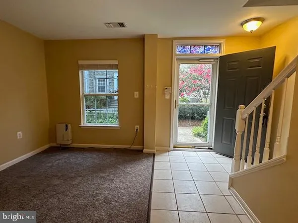 a view of an entryway with a door