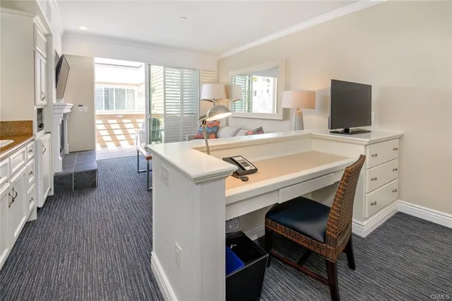 a room with furniture a flat screen tv and a rug