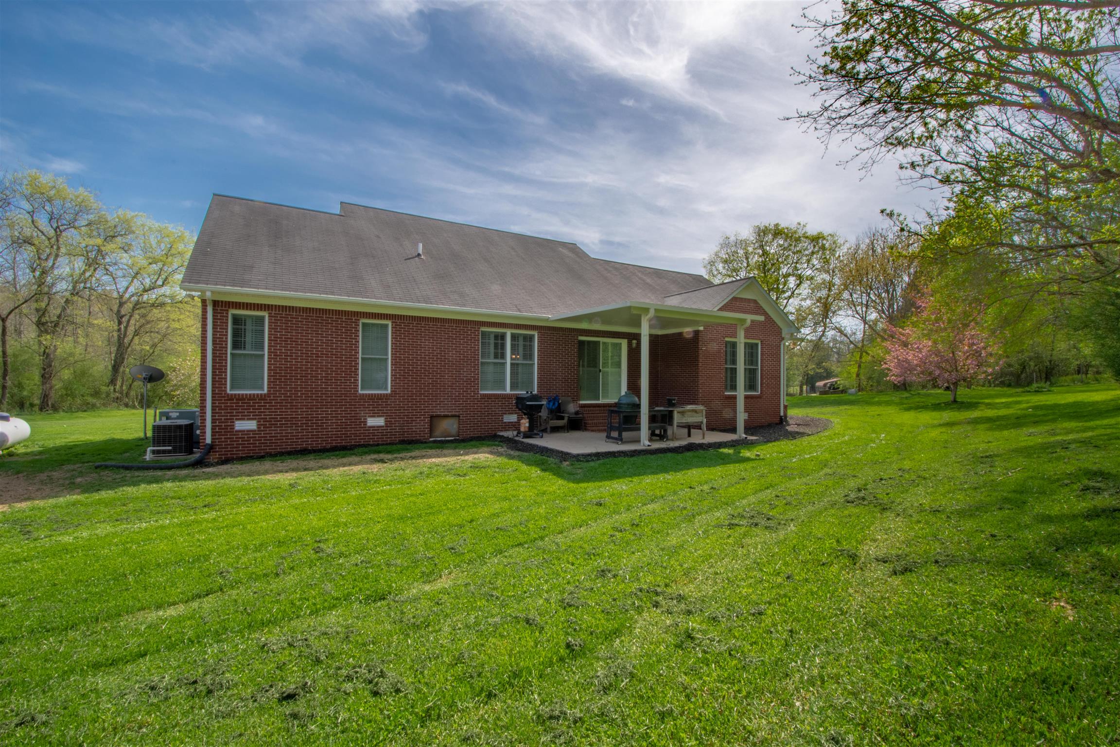10475 Bethel Road Prospect, TN 38477 - Photo 29 of 30 a view of a house with backyard and a tree