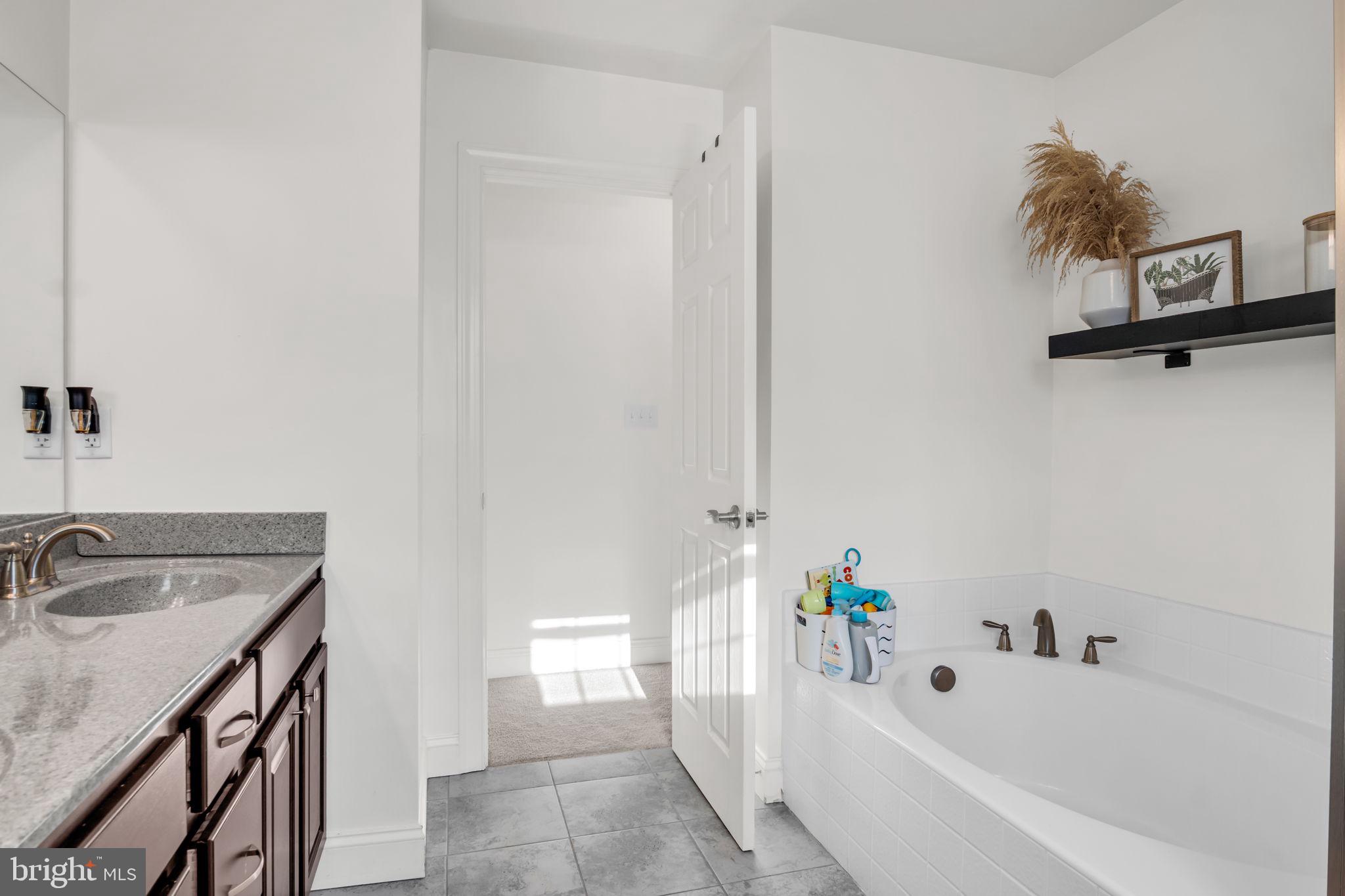 100 Eagle Road Dillsburg, PA 17019 - Photo 21 of 45 a bathroom with a tub sink and mirror