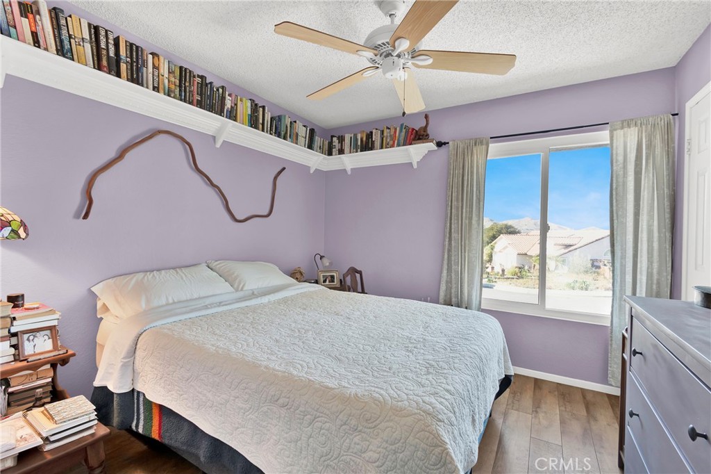 3350 May Court Riverside, CA 92503 - Photo 12 of 55 a bedroom with a bed a chandelier and dresser