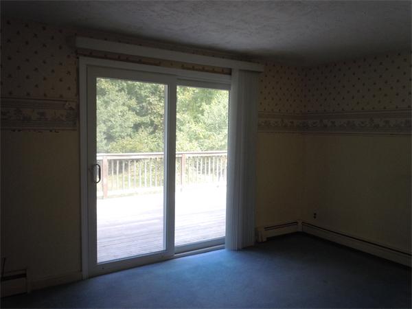 22 Lyndon Road Sharon, MA 02067 - Photo 12 of 15 a view of an empty room and a window