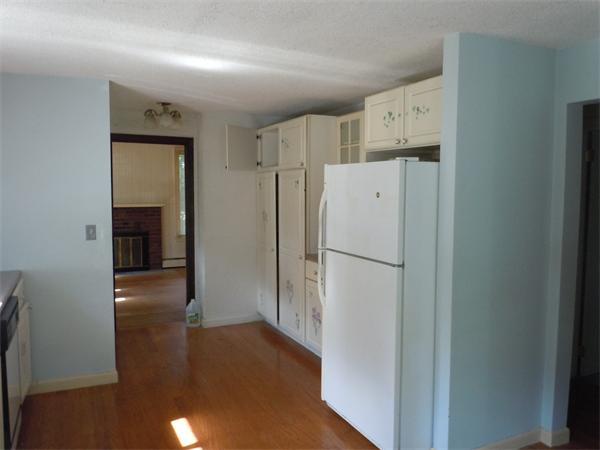 22 Lyndon Road Sharon, MA 02067 - Photo 14 of 15 a view of a kitchen with refrigerator and wooden floor