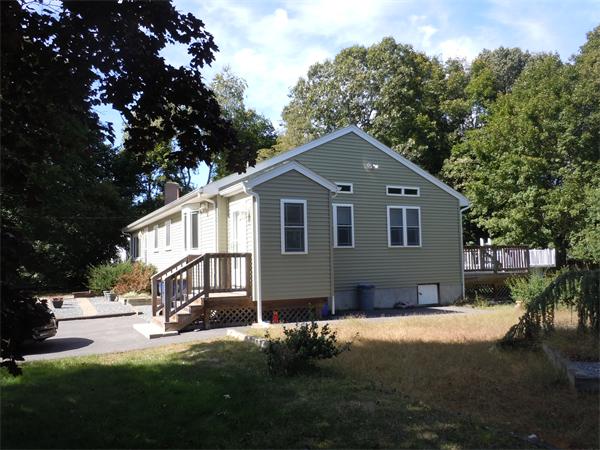 22 Lyndon Road Sharon, MA 02067 - Photo 2 of 15 a front view of a house with a garden