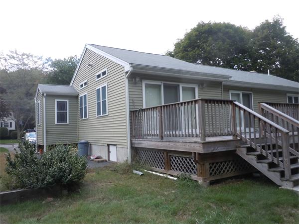 22 Lyndon Road Sharon, MA 02067 - Photo 4 of 15 a front view of a house with a garden
