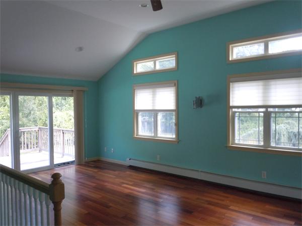 22 Lyndon Road Sharon, MA 02067 - Photo 7 of 15 a view of an empty room with wooden floor and a window