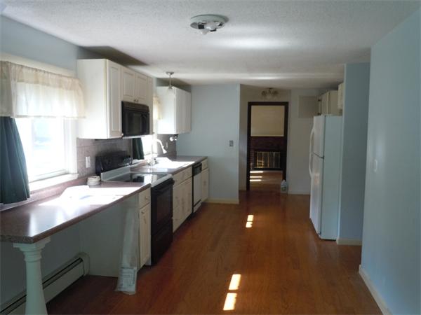 22 Lyndon Road Sharon, MA 02067 - Photo 10 of 15 a kitchen with a sink and a refrigerator
