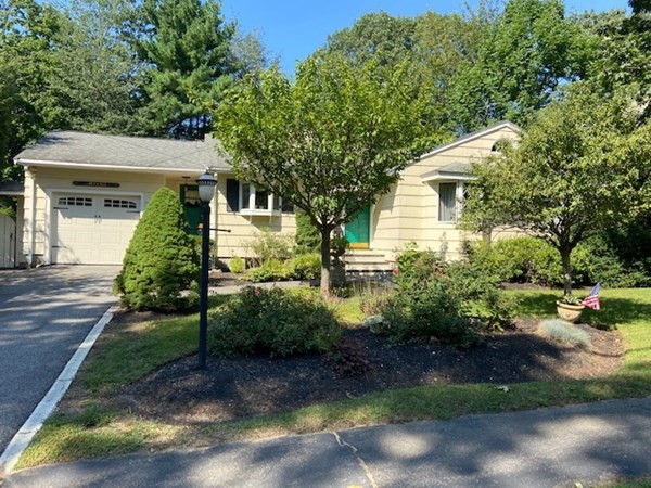 76 Woodledge Road Needham, MA 02492 - Photo 1 of 12 a front view of a house with a yard