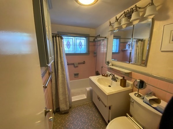 76 Woodledge Road Needham, MA 02492 - Photo 12 of 12 a bathroom with a sink toilet and shower