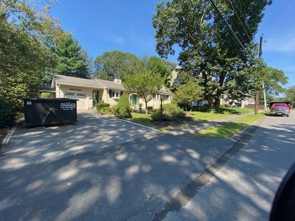 76 Woodledge Road Needham, MA 02492 - Photo 2 of 12 a view of a house with a yard and pathway