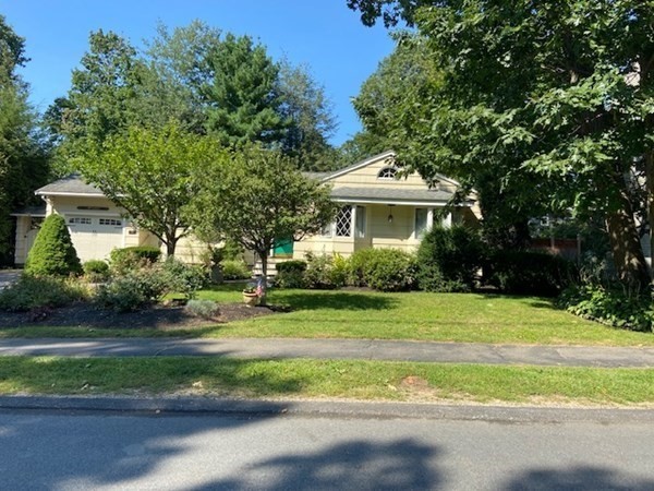 76 Woodledge Road Needham, MA 02492 - Photo 3 of 12 a front view of a house with a yard