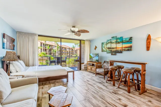 a bedroom with furniture and wooden floor
