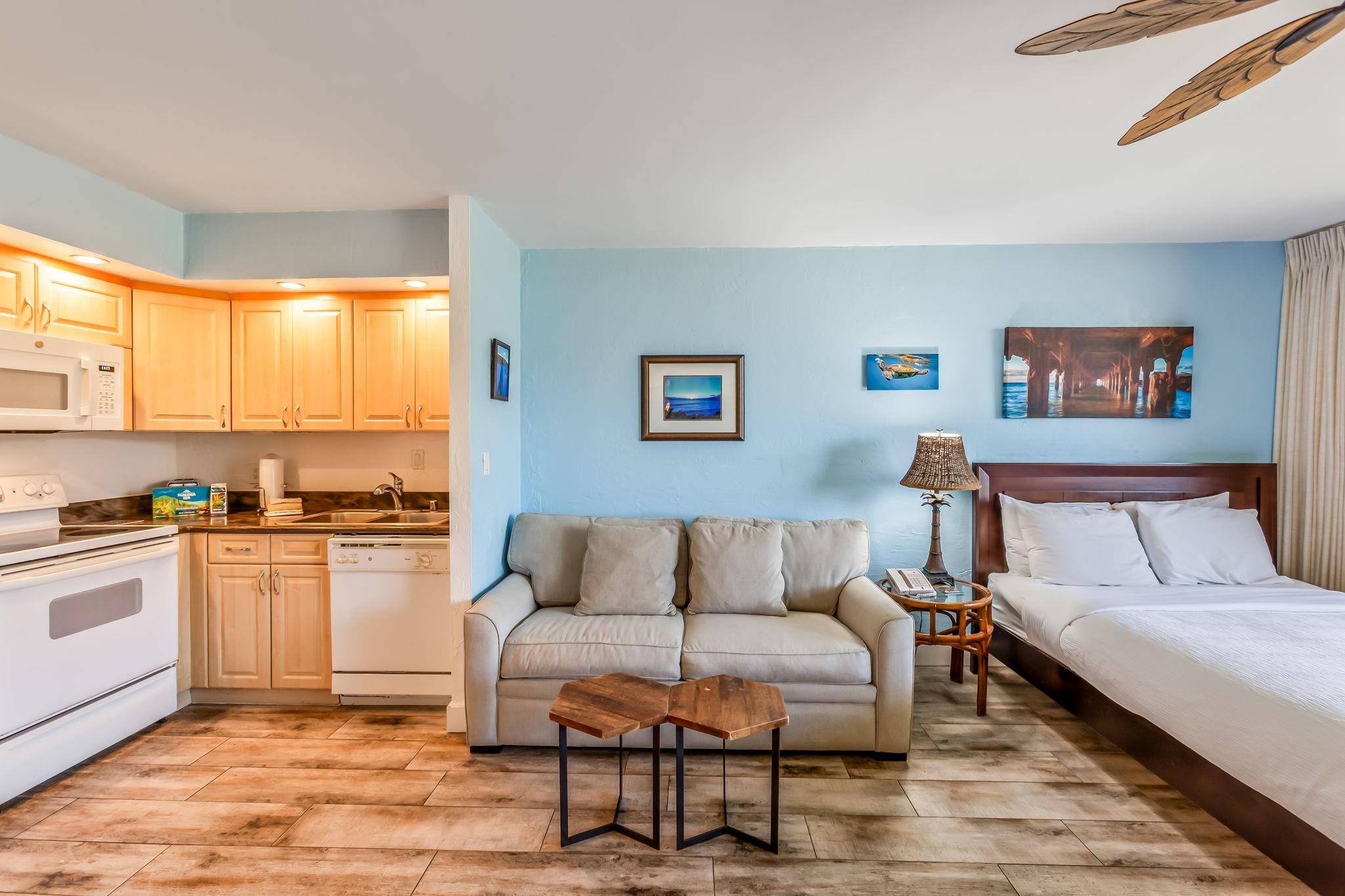 3543 Lower Honoapiilani Road, Unit C204 Lahaina, HI 96761 - Photo 13 of 28 a living room with furniture and a kitchen