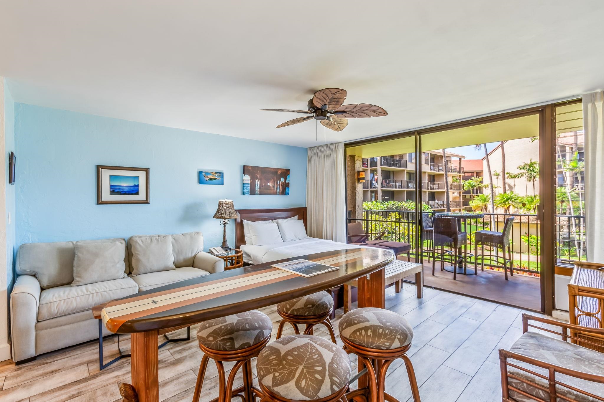 3543 Lower Honoapiilani Road, Unit C204 Lahaina, HI 96761 - Photo 17 of 28 a living room with furniture and a large window