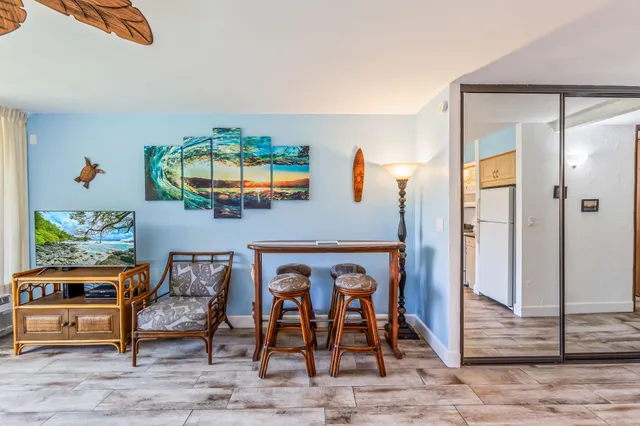 a dining room with furniture and window