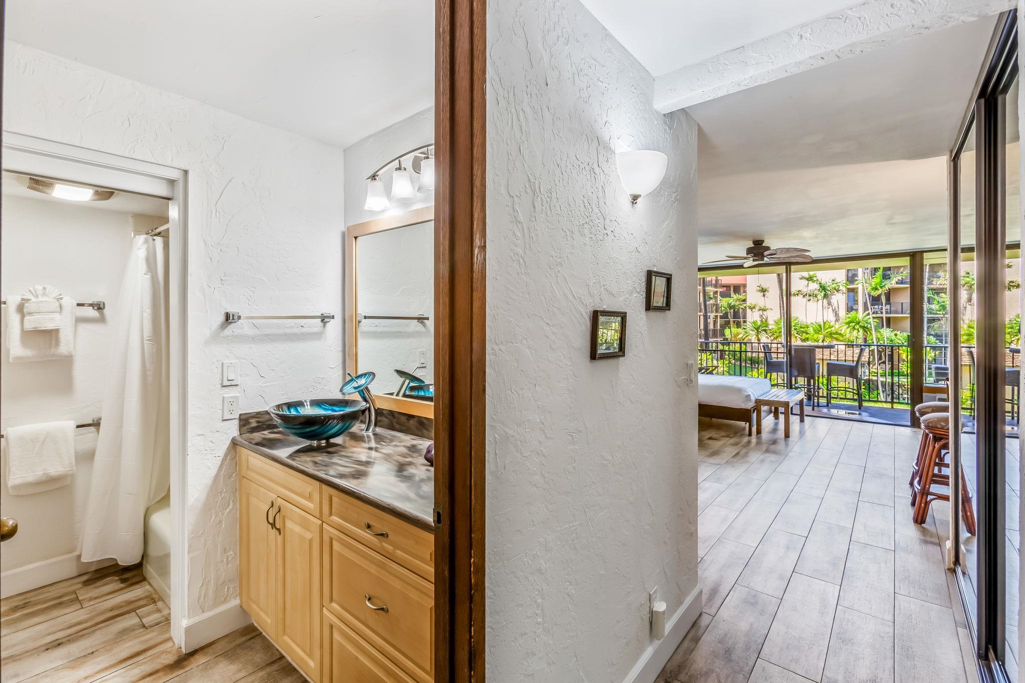 3543 Lower Honoapiilani Road, Unit C204 Lahaina, HI 96761 - Photo 19 of 28 a open kitchen with stainless steel appliances granite countertop a stove and a refrigerator