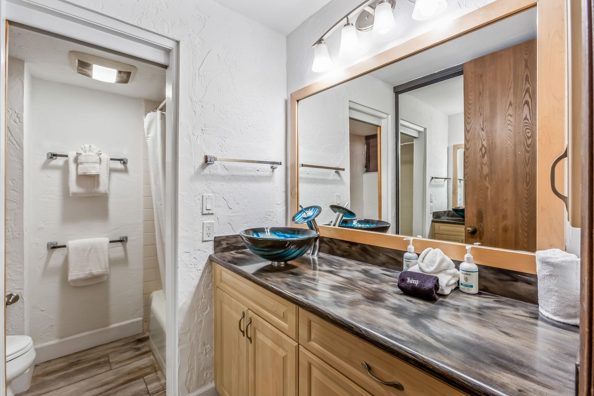 3543 Lower Honoapiilani Road, Unit C204 Lahaina, HI 96761 - Photo 20 of 28 a bathroom with a double vanity sink and a mirror
