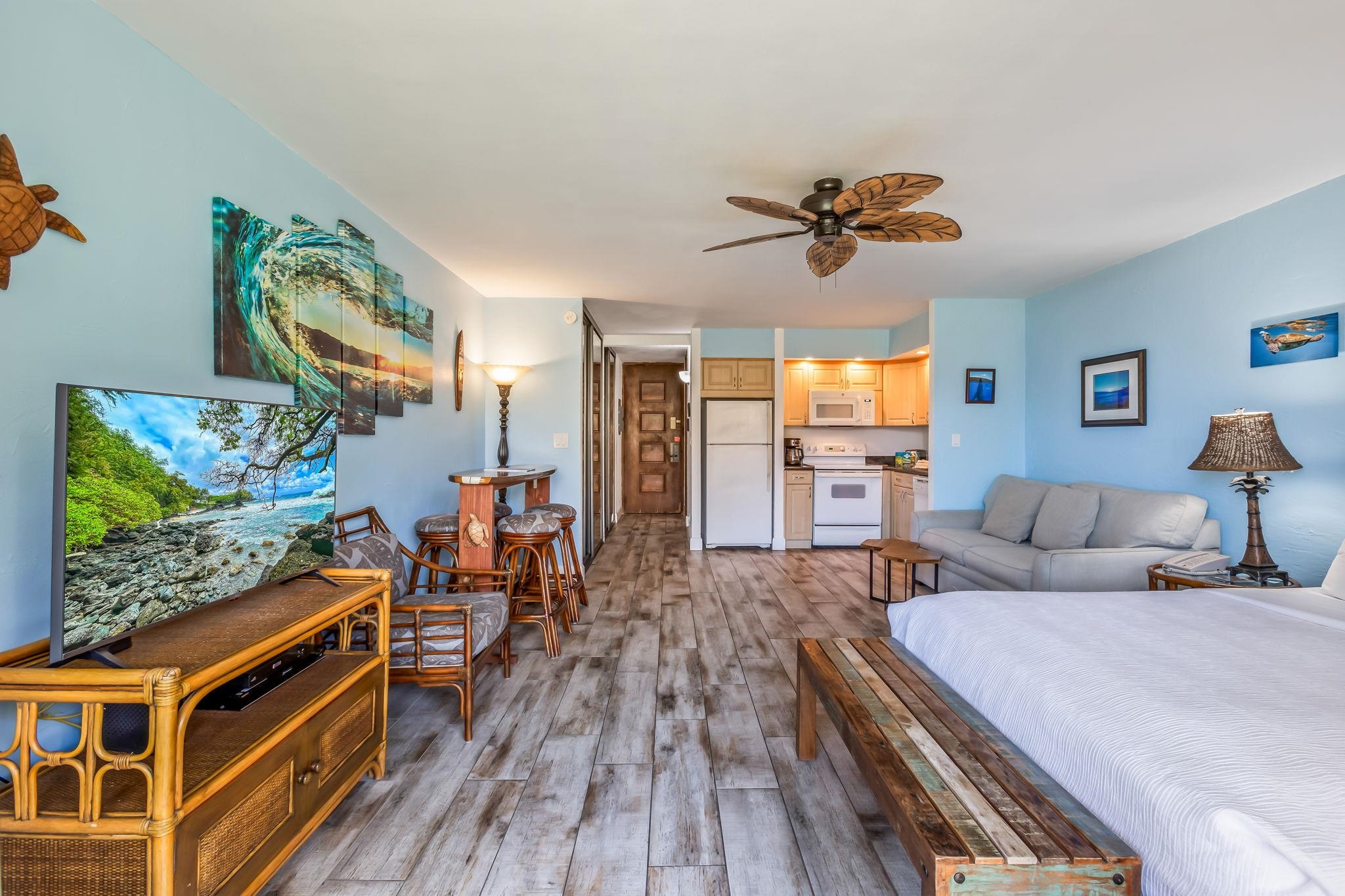 3543 Lower Honoapiilani Road, Unit C204 Lahaina, HI 96761 - Photo 7 of 28 a living room with furniture and a flat screen tv