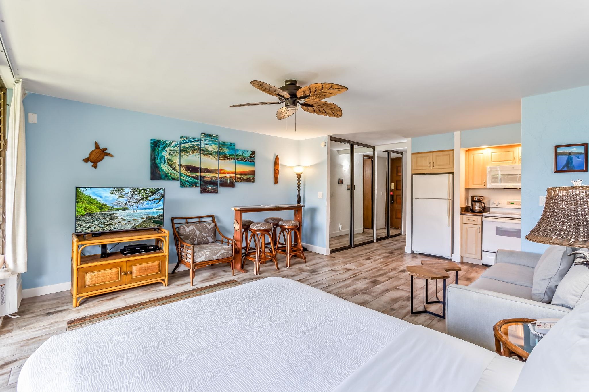 3543 Lower Honoapiilani Road, Unit C204 Lahaina, HI 96761 - Photo 8 of 28 a living room with furniture and a flat screen tv