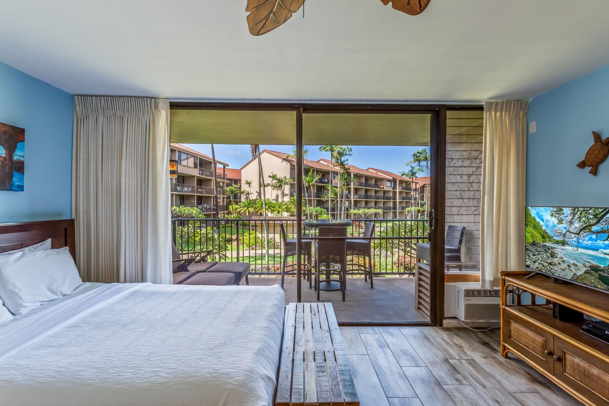 3543 Lower Honoapiilani Road, Unit C204 Lahaina, HI 96761 - Photo 9 of 28 a view of a bedroom with furniture and balcony