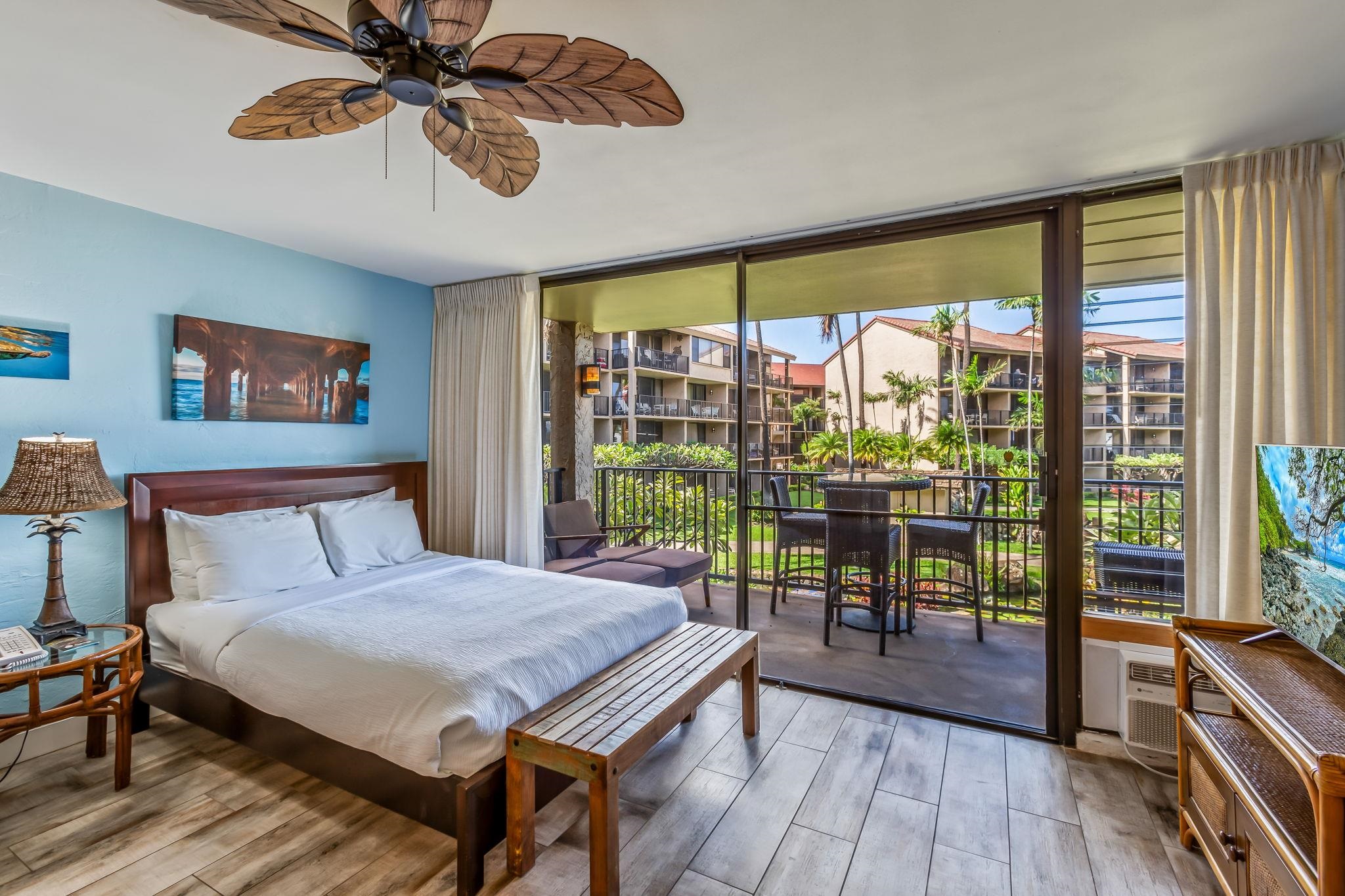 3543 Lower Honoapiilani Road, Unit C204 Lahaina, HI 96761 - Photo 10 of 28 a bedroom with a bed and wooden floor