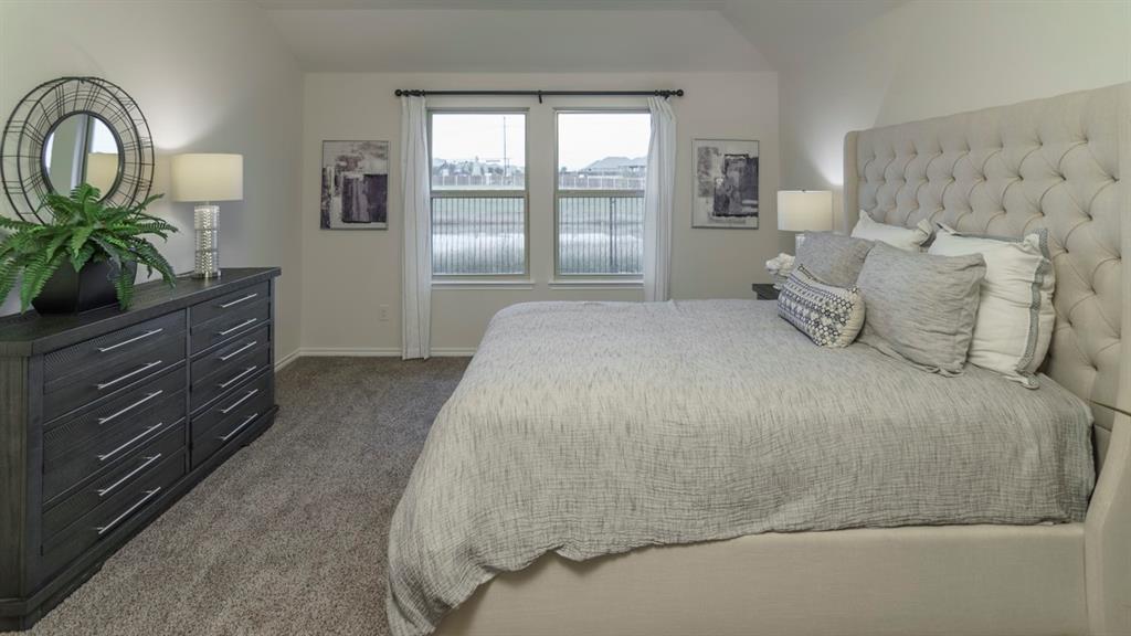 3100 Charleston Drive Ennis, TX 75119 - Photo 3 of 23 Carpeted bedroom featuring neutral walls and a vaulted ceiling