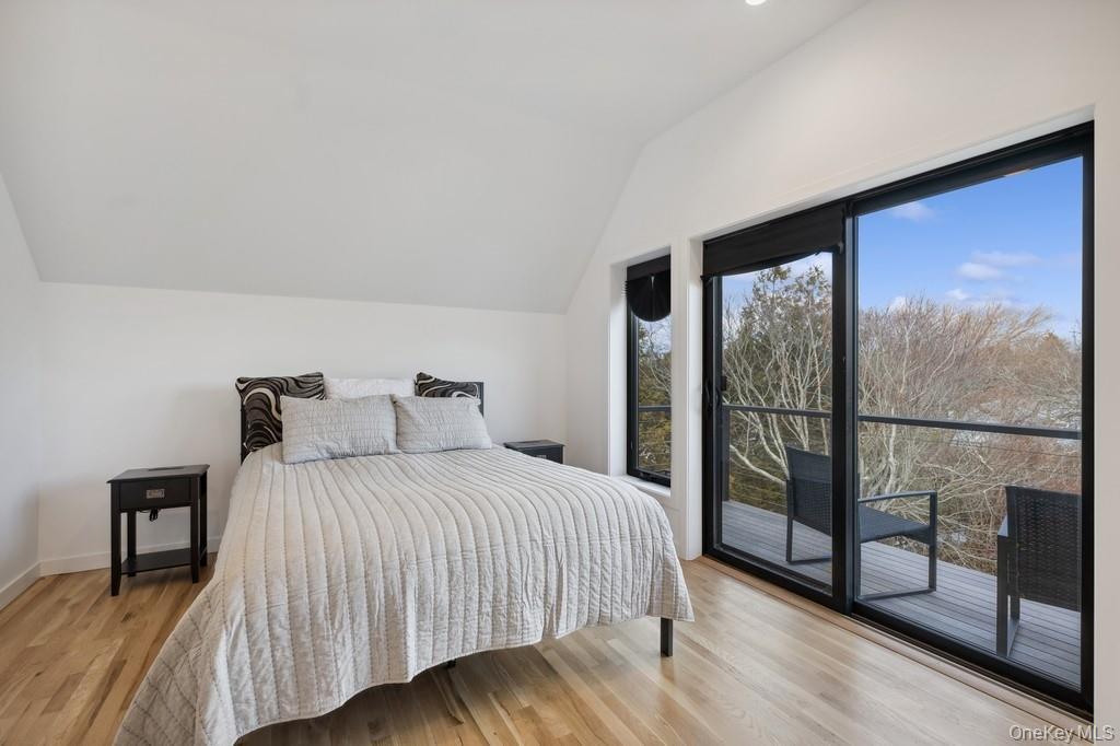 45 Ditch Plains Road Montauk, NY 11954 - Photo 11 of 19 a bedroom with a bed and a window