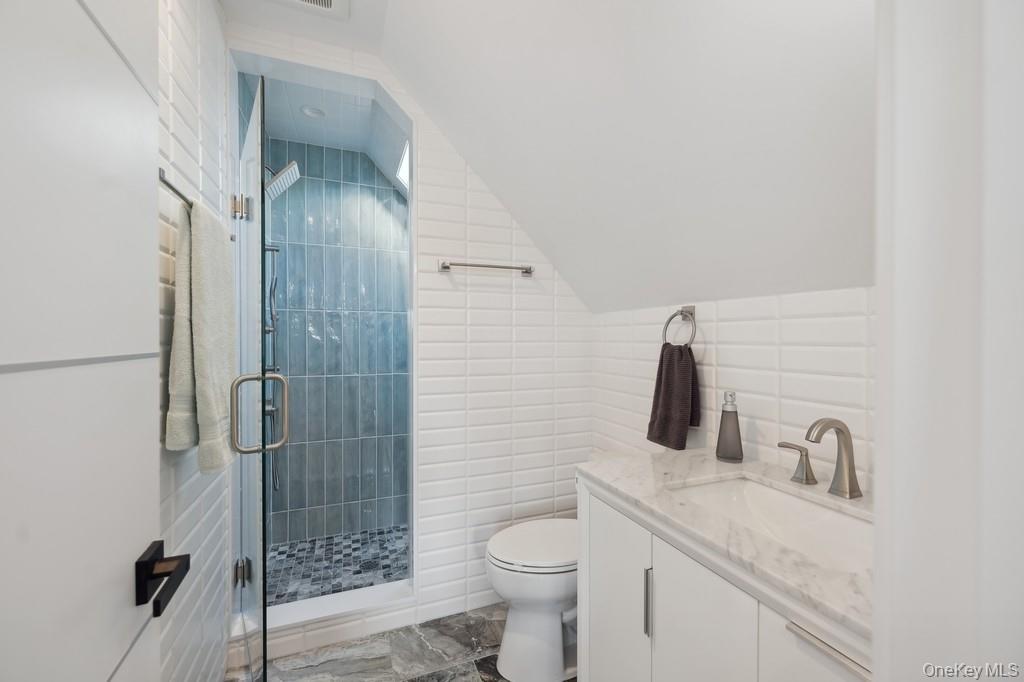 45 Ditch Plains Road Montauk, NY 11954 - Photo 12 of 19 a bathroom with a granite countertop sink toilet and shower