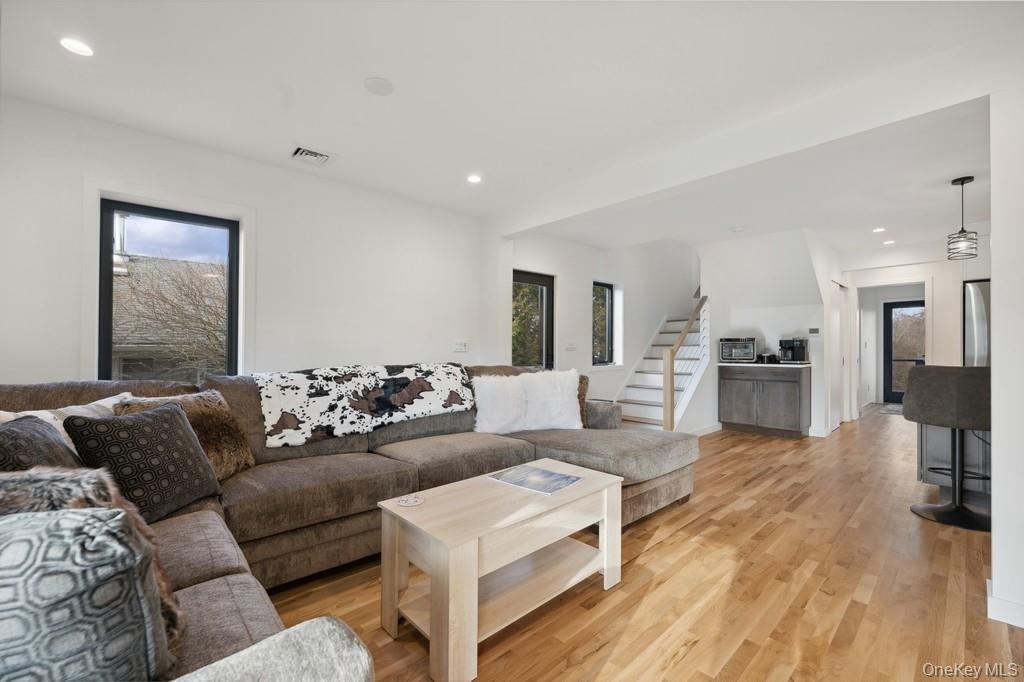 45 Ditch Plains Road Montauk, NY 11954 - Photo 3 of 19 a living room with furniture and a wooden floor