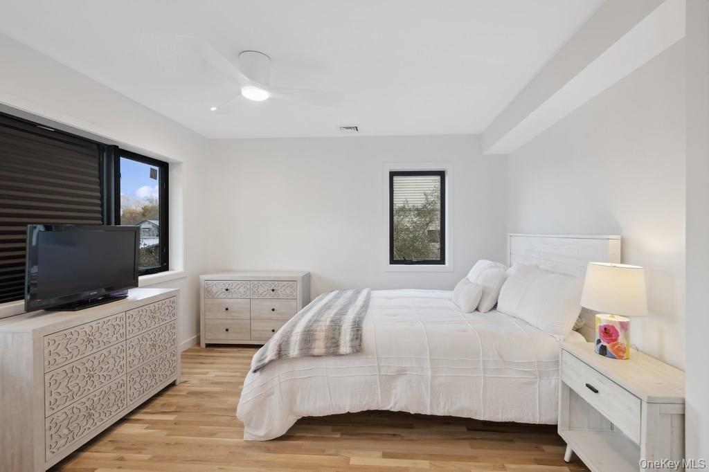 45 Ditch Plains Road Montauk, NY 11954 - Photo 9 of 19 a bedroom with a bed and flat screen tv