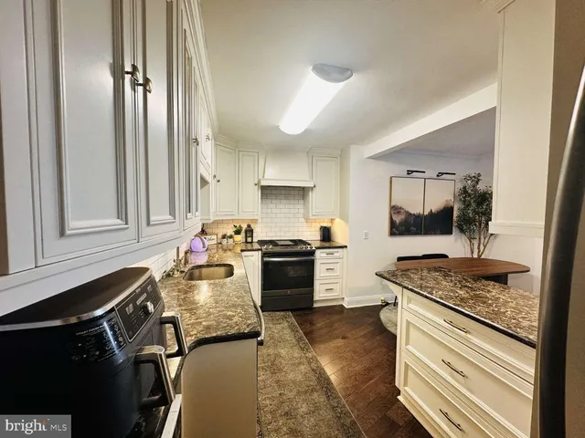 a bedroom with a bed window and a table