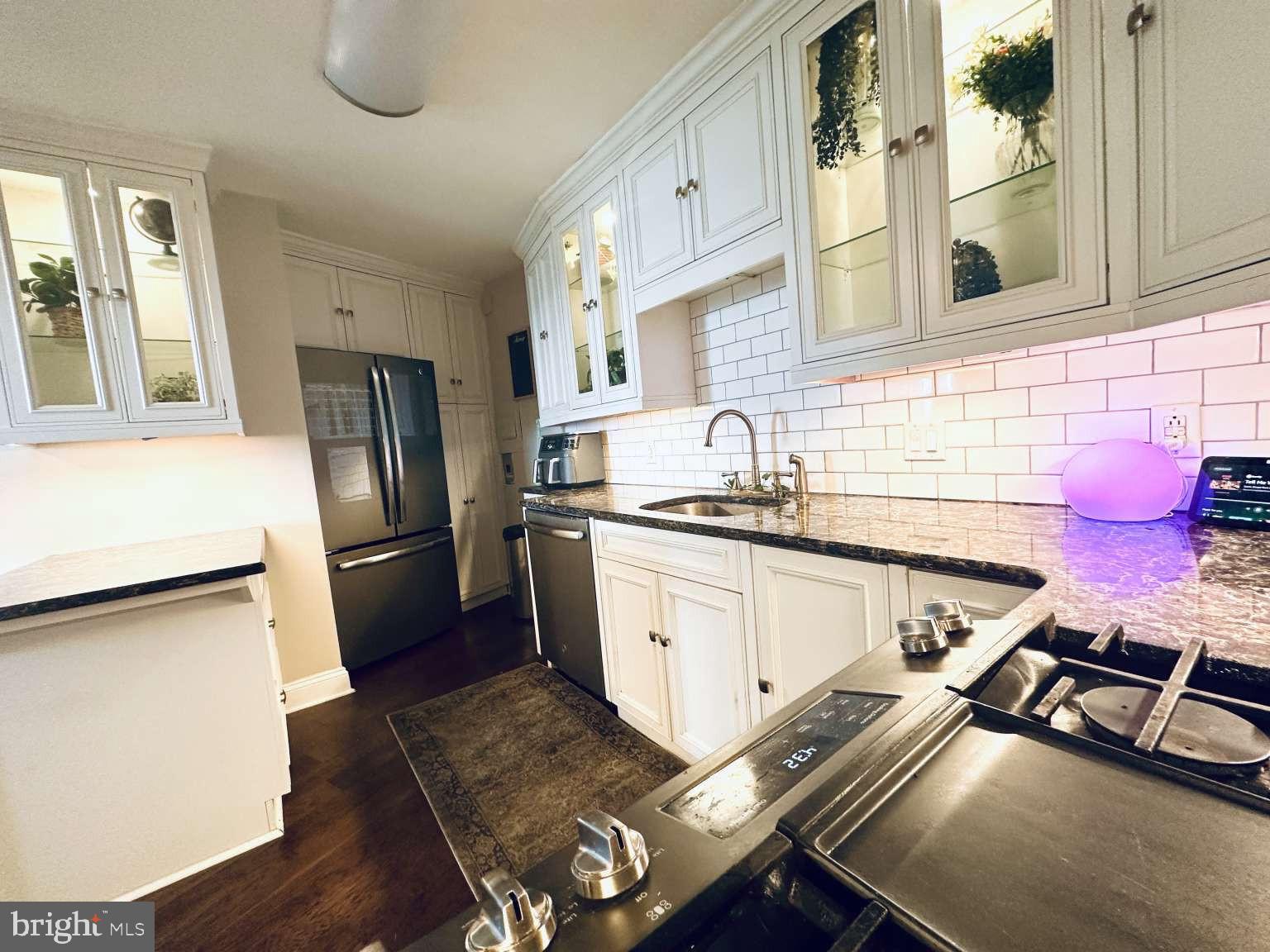 3900 West Ford Road, Unit 18K Philadelphia, PA 19131 - Photo 18 of 49 a kitchen with a sink appliances and cabinets