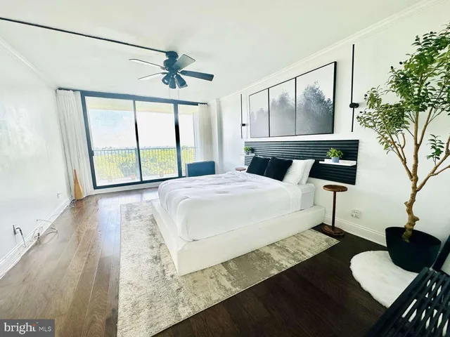 a bedroom with a bed window and a table