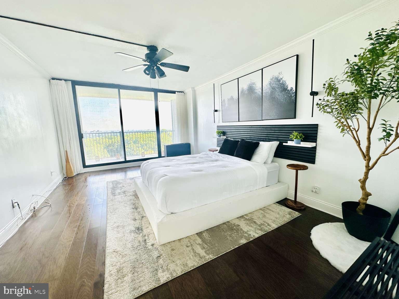 3900 West Ford Road, Unit 18K Philadelphia, PA 19131 - Photo 22 of 49 a bedroom with a bed window and a table