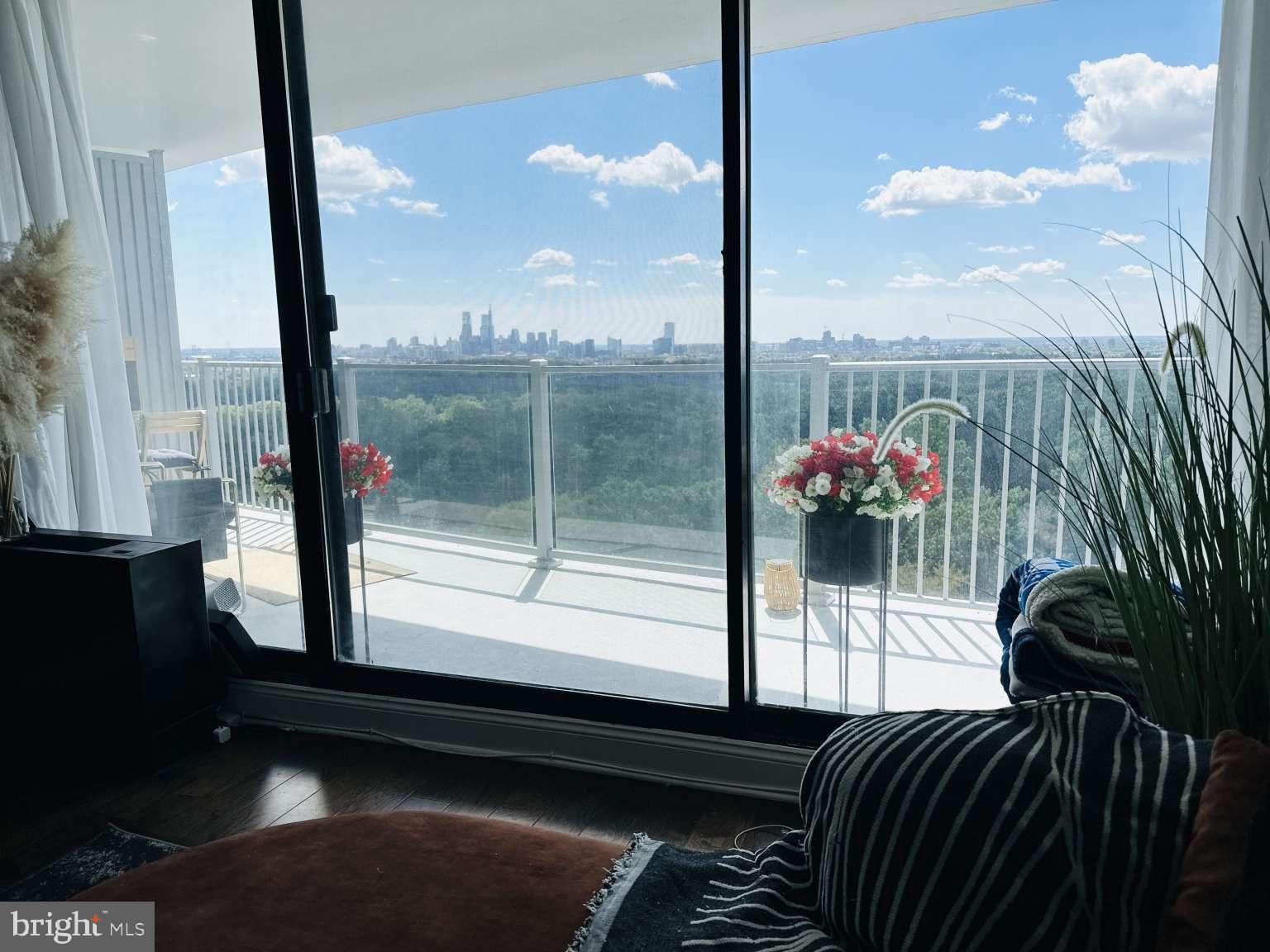 3900 West Ford Road, Unit 18K Philadelphia, PA 19131 - Photo 33 of 49 a view of balcony with a potted plant