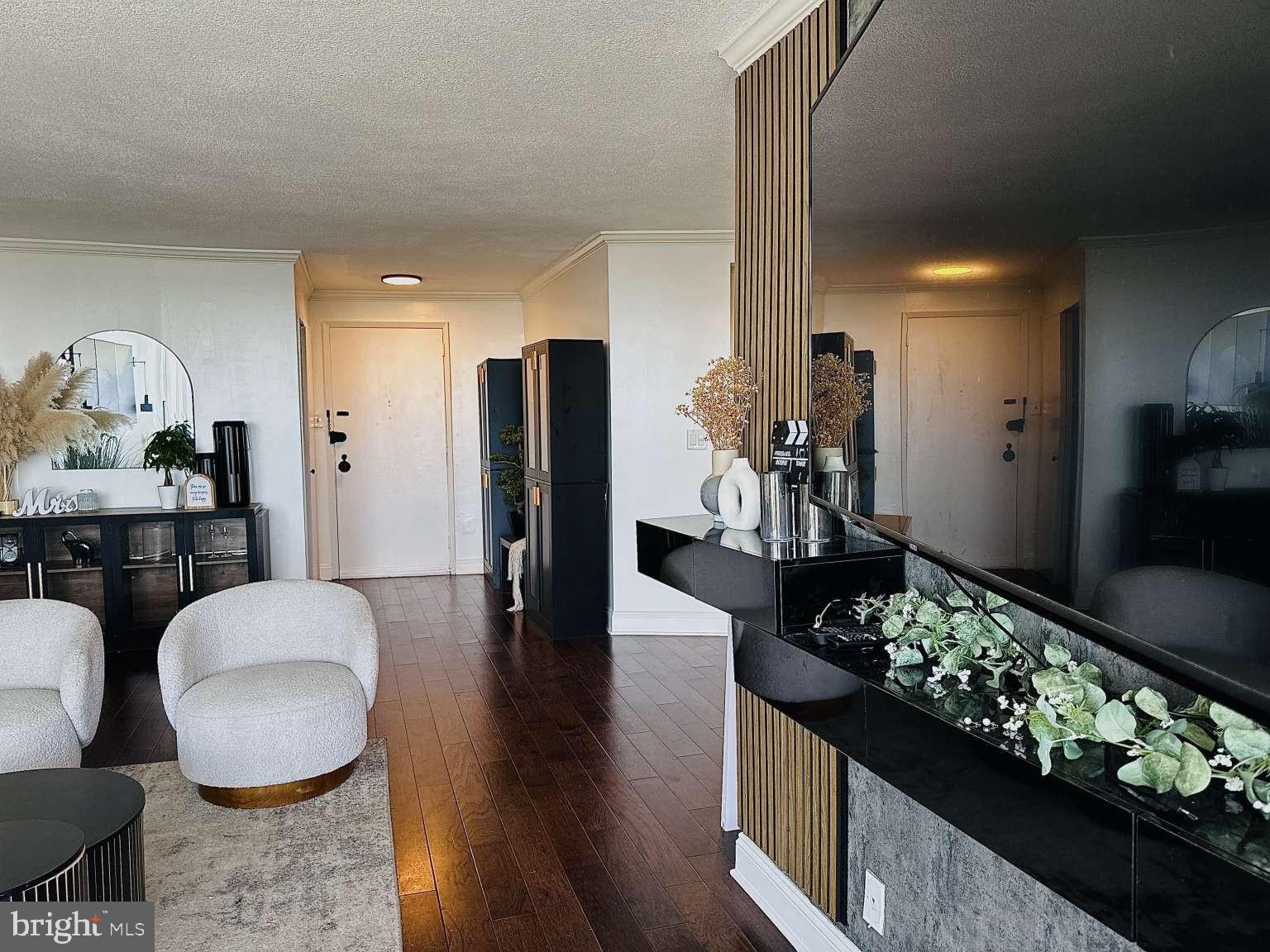 3900 West Ford Road, Unit 18K Philadelphia, PA 19131 - Photo 6 of 49 a dining room with furniture and wooden floor