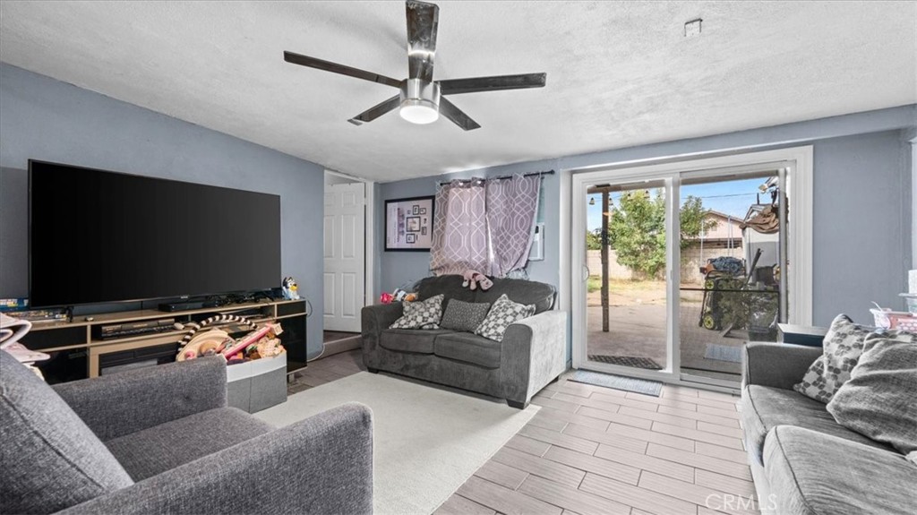 1030 North Western Avenue Colton, CA 92324 - Photo 12 of 32 a living room with furniture and a flat screen tv