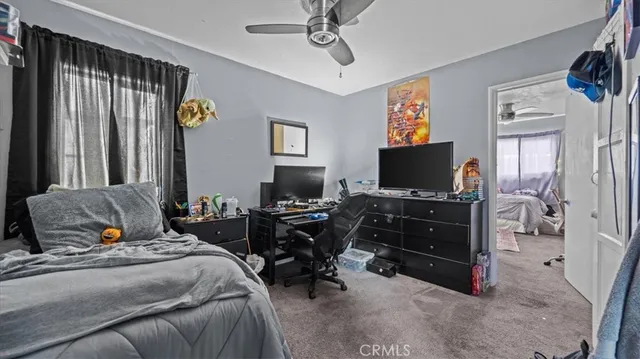 a bedroom with a bed and furniture