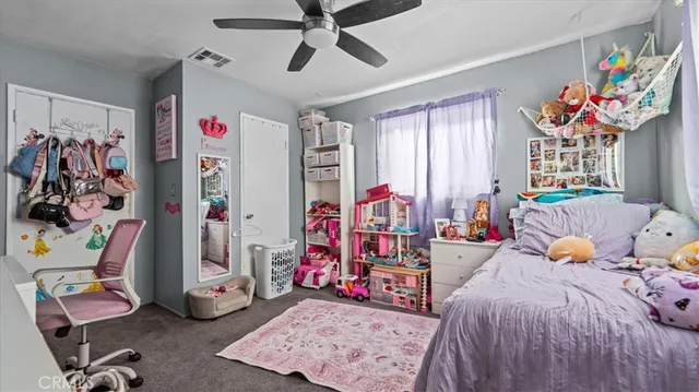 a bed room with a bed and a desk