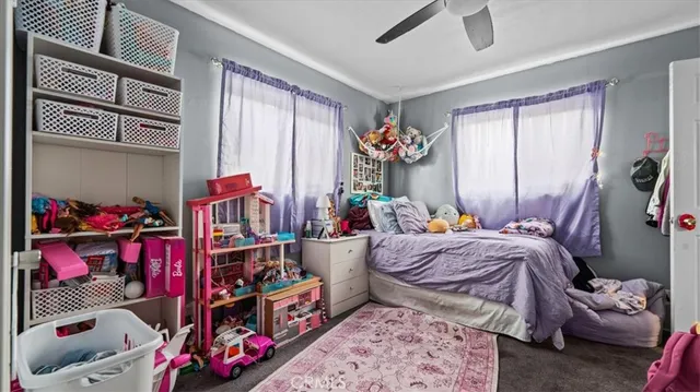 a bed room with a bed and a window