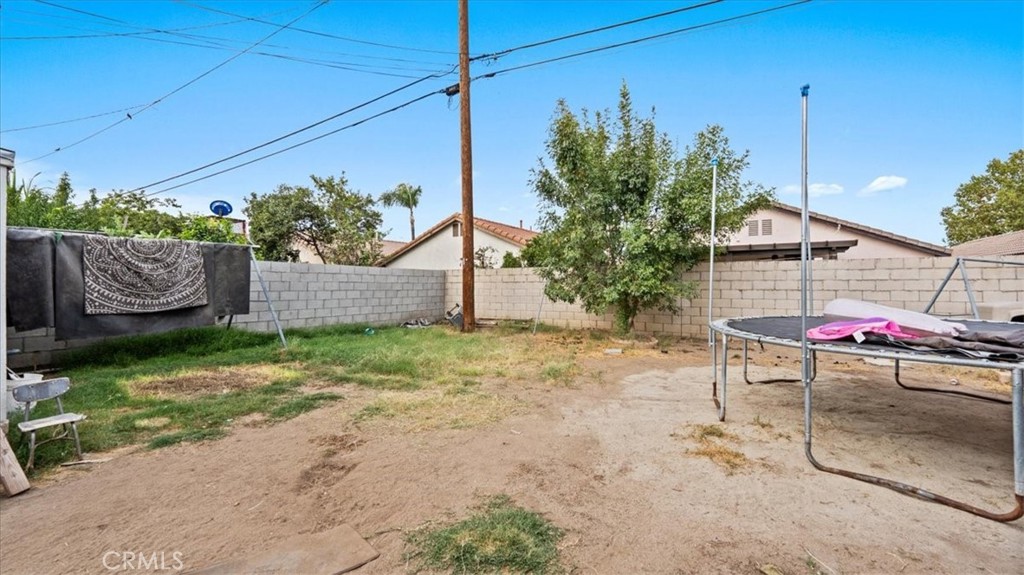 1030 North Western Avenue Colton, CA 92324 - Photo 22 of 32 a backyard of a house with table and chairs