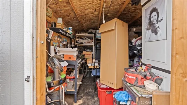 walk in closet with an outdoor seating