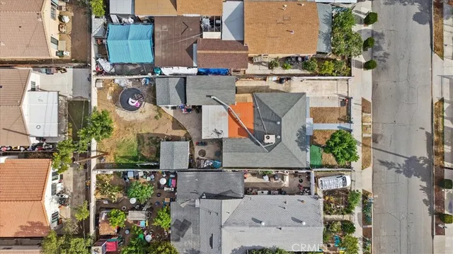 an aerial view of houses with outdoor space