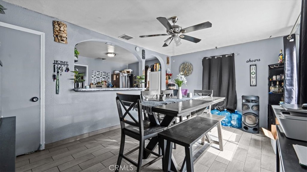1030 North Western Avenue Colton, CA 92324 - Photo 6 of 32 a view of a dining room with furniture and a chandelier