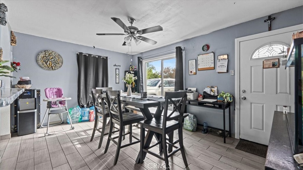 1030 North Western Avenue Colton, CA 92324 - Photo 7 of 32 a view of a dining room with furniture and wooden floor